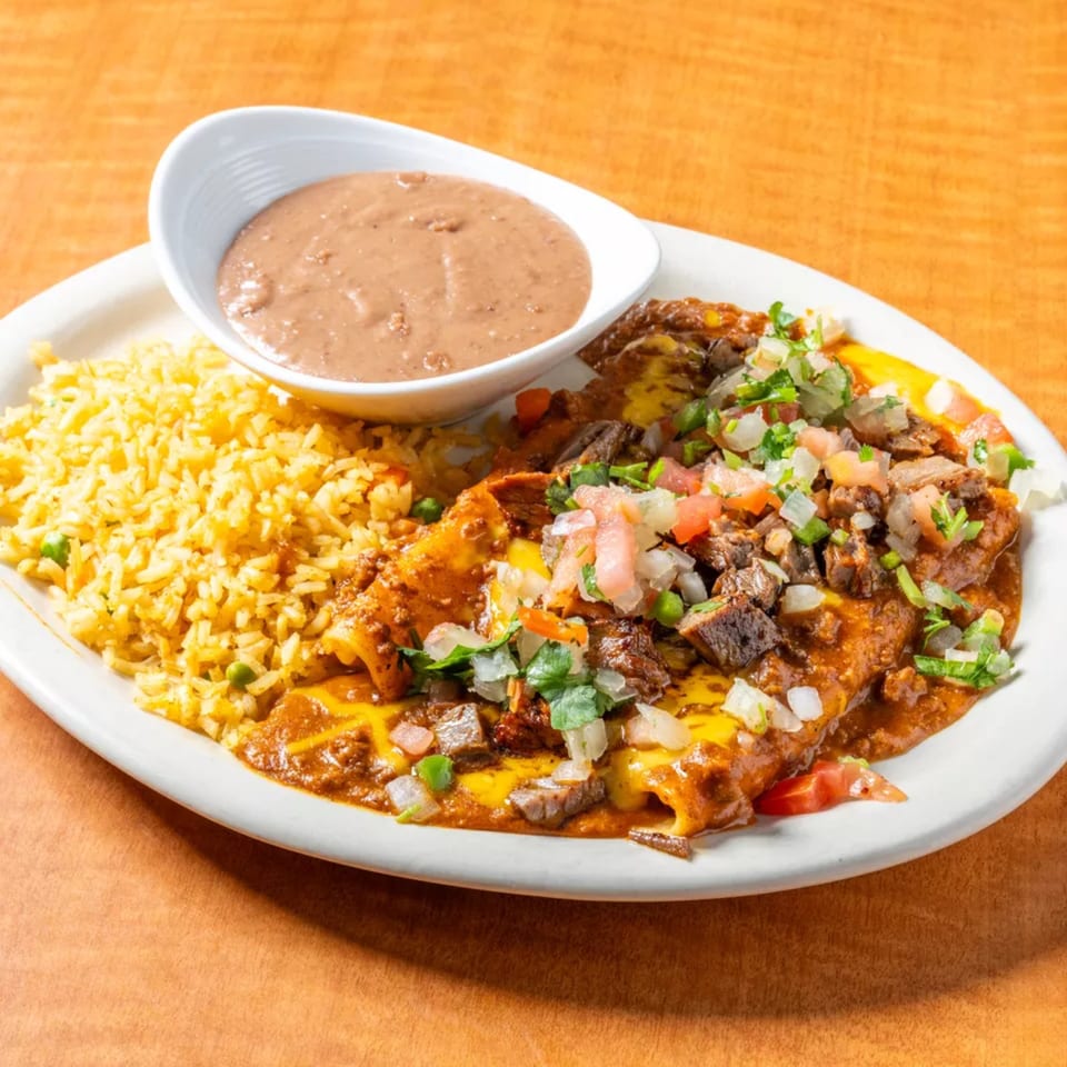 Cancun Mexican Restaurant's enchiladas with rice, refried beans, and pico de gallo.